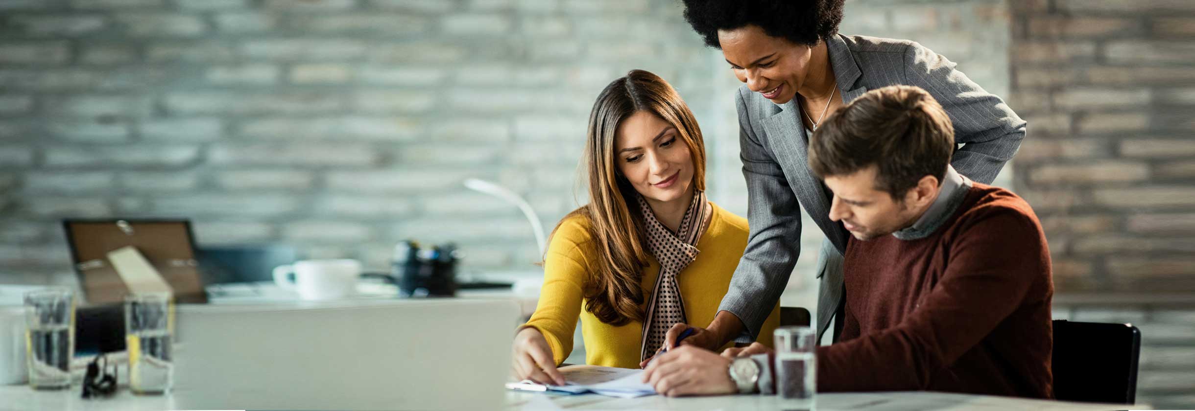 Couple with Banker talking about CD rates